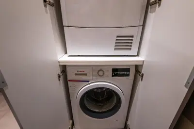 a washer and dryer in a small room at Loft Porta Maggiore in Rome
