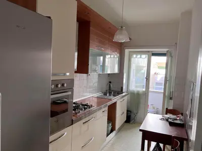 a kitchen with a sink and a stove top oven at Dolce Vita Rooms Monteverde Trastevere in Rome
