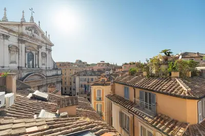 a view of roofs of buildings in a city at Casa Adriana, a Burghesius home in Rome