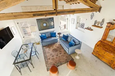 an overhead view of a living room with blue furniture at Casa Adriana, a Burghesius home in Rome