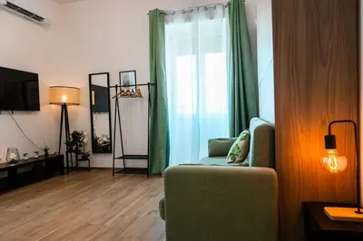 a living room with a couch and a window at Re di Roma apartment in Rome