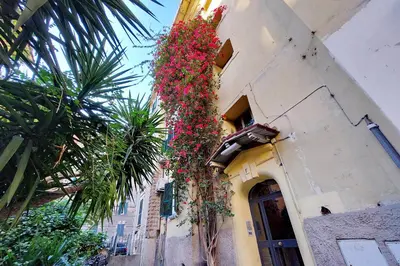 a building with flowers on the side of it at YCH-Brand new Vatican flat with terrace in Rome