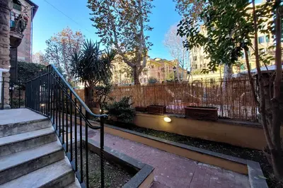 a wrought iron fence in front of a building at YCH-Brand new Vatican flat with terrace in Rome