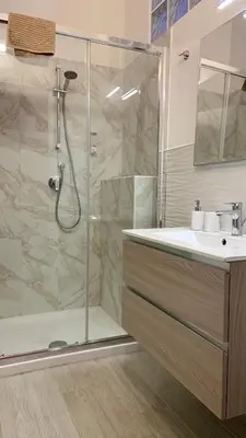 a bathroom with a shower and a sink at Mate's Apartment in Rome