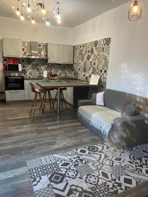 a living room with a couch and a table at Casa Bravetta - Parking Private in Rome