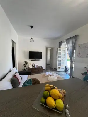 a room with a bed and a plate of fruit on a table at Casa Bravetta - Parking Private in Rome