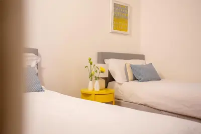 two beds sitting next to each other in a room at Casa Cristina in Piazza Farnese in Rome