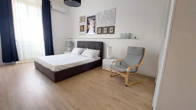 a bedroom with a bed and a chair at Galleria del Principe in Rome