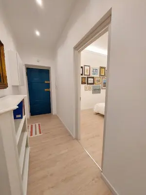 a hallway with a blue door in a room at Galleria del Principe in Rome