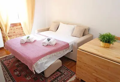a bedroom with a bed with two towels on it at Casa Tua sul Tetto di Roma in Rome