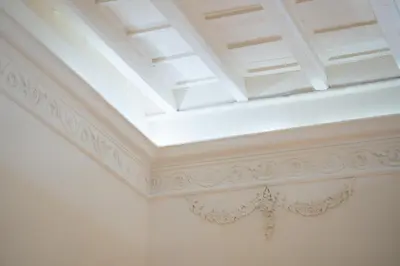 a ceiling in a room with a white ceiling at Suites Rome in Rome