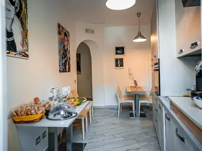 a kitchen with a table with a bowl of food on it at Casa Celestina Roma in Rome