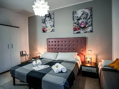 a bedroom with a large bed with towels on it at Casa Celestina Roma in Rome