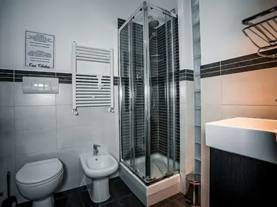 a bathroom with a toilet and a shower and a sink at Casa Celestina Roma in Rome