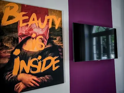 two posters hanging on a wall next to a door at Casa Celestina Roma in Rome