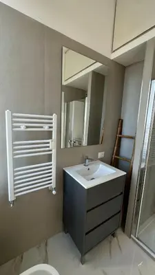 a bathroom with a sink and a mirror at Maison Merulana Colosseo in Rome