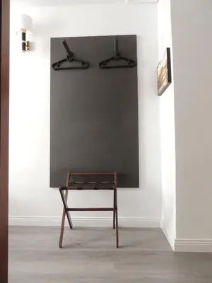 a chair in a room with a blackboard on a wall at Madonna della Neve in Rome