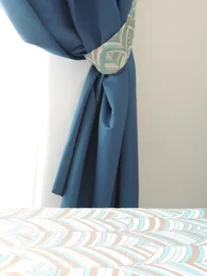 a blue curtain is hanging on a wall at Madonna della Neve in Rome