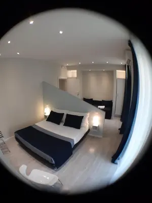 a bedroom with a large bed in a room at Little Rose Lodge in Rome