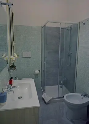 a bathroom with a shower and a sink and a toilet at La maison de Rome Vatican Apart in Rome