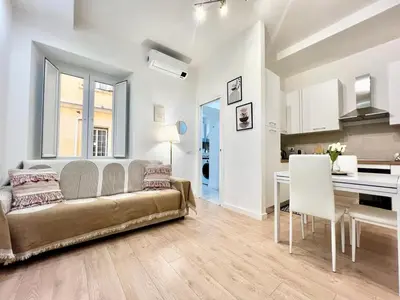 a living room with a couch and a table at Saint Peter 78 - Design Apartment in Rome