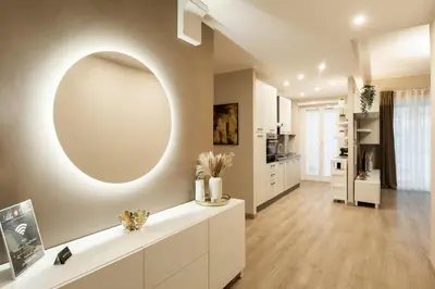 a living room with a large mirror on the wall at Albadomus Apartment in Rome