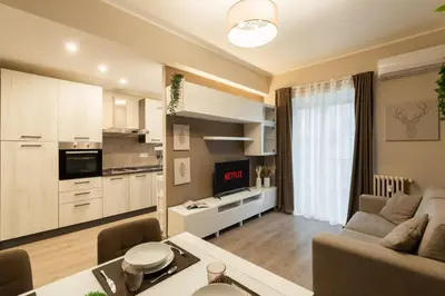 a living room with a couch and a table at Albadomus Apartment in Rome