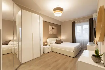 a bedroom with two beds and a glass door at Albadomus Apartment in Rome