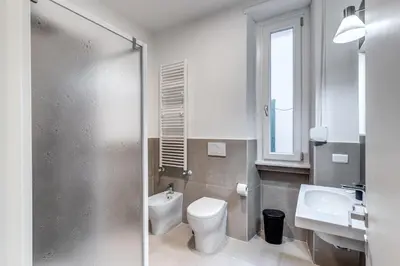 a bathroom with a toilet and a sink at INN3 APT in Rome