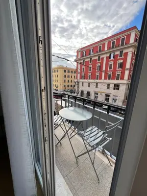 a view of a balcony with a table and chairs at Vittoria's Luxury Rooms in Rome