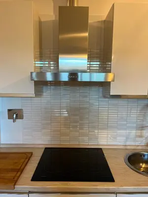 a kitchen with a sink and a stove at Marcus Modern Apartment in Rome