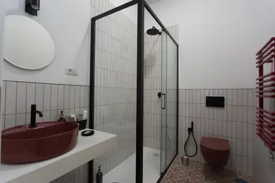 a bathroom with a sink and a glass shower at Navona 68 in Rome
