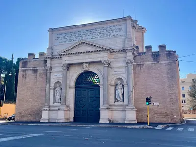a large brick building with a large door at Professor's house in Porta Pia in Rome