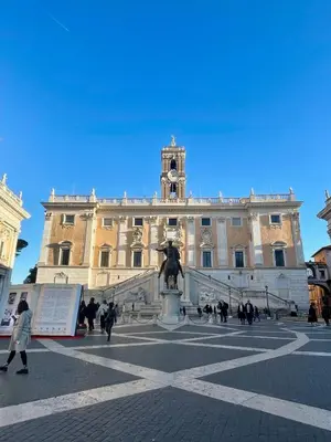 a large building with a statue in front of it at Professor's house in Porta Pia in Rome