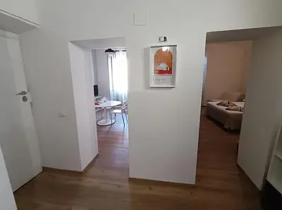 a hallway with a room with a bed and a table at Casa Filiberto in Rome