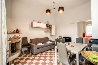 a living room with a couch and a table at Suite Experience Termini Station Apartment in Rome