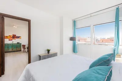 a bedroom with a bed and a large window at Laterano View by Rental in Rome in Rome