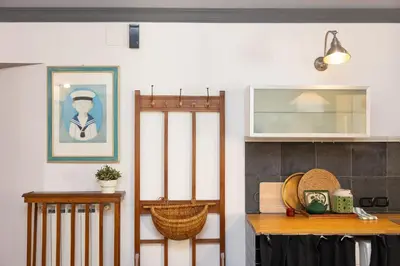 a kitchen with a table and a picture on the wall at Pantheon by Rental in Rome in Rome