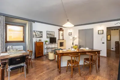 a living room with a table and a dining room at Pantheon by Rental in Rome in Rome