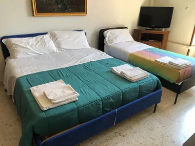 two beds sitting next to each other in a room at Apartment Rome Vatican in Rome