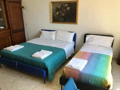 two beds sitting next to each other in a room at Apartment Rome Vatican in Rome