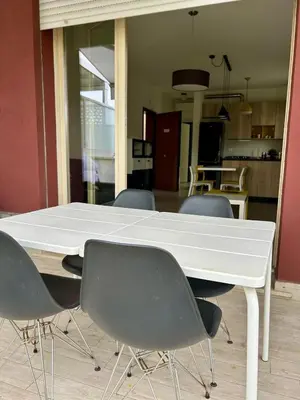 a white table and chairs in a room at 8380 Lory's House in Rome