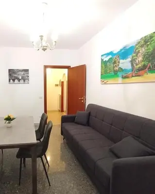 a living room with a couch and a table at La Dimora di Magi in Rome