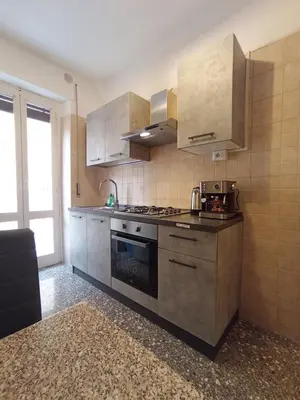 a kitchen with stainless steel cabinets and a stove at La Dimora di Magi in Rome