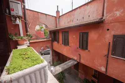 an outside view of a building with a balcony at Evelina in Trastevere in Rome