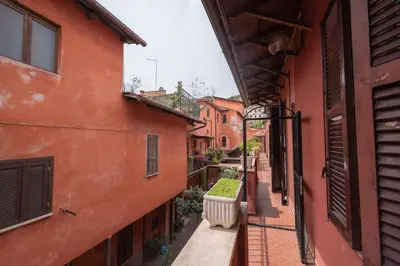 an alleyway between two buildings in a city at Evelina in Trastevere in Rome