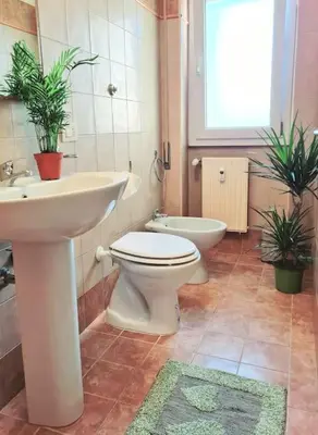 a bathroom with a sink and a toilet and a sink at Casa del Vicario al Vaticano in Rome