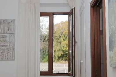 an open door with a window in a room at Homs Apartment In Rome by Halldis in Rome