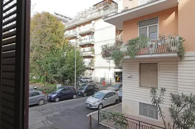a view from a window of a street with parked cars at Homs Apartment In Rome by Halldis in Rome