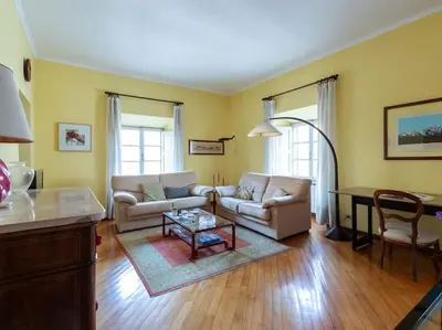 a living room with two couches and a table at Porta Pia Elegant Two Bedroom in Rome